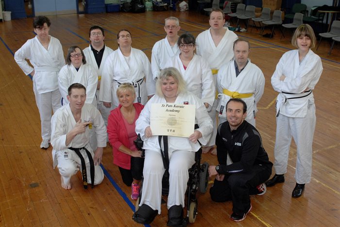Lisa "Maddy" Thomson becomes the first female wheelchair user in Wales to achieve black belt status